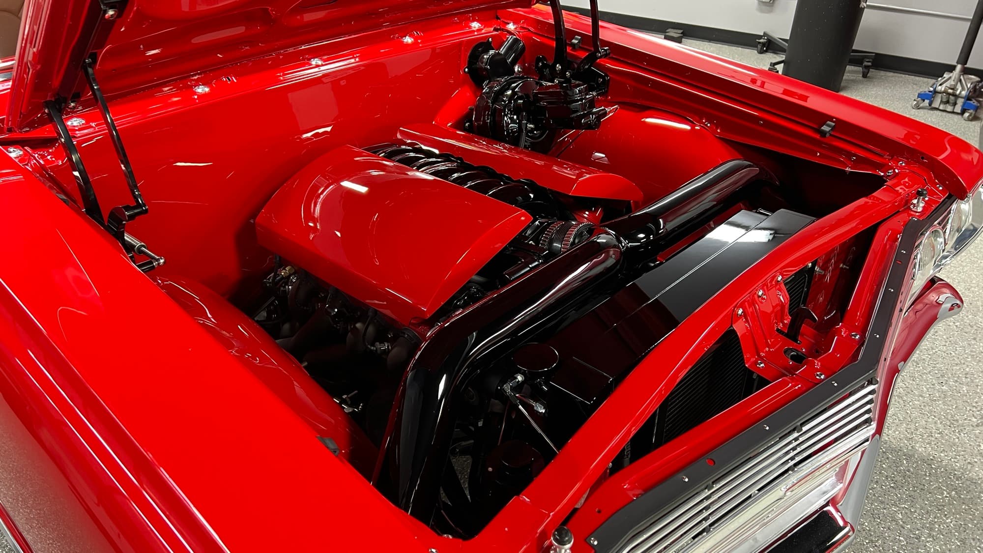 Polished and detailed engine bay on a classic show car at The Recon Pros Huntington Beach