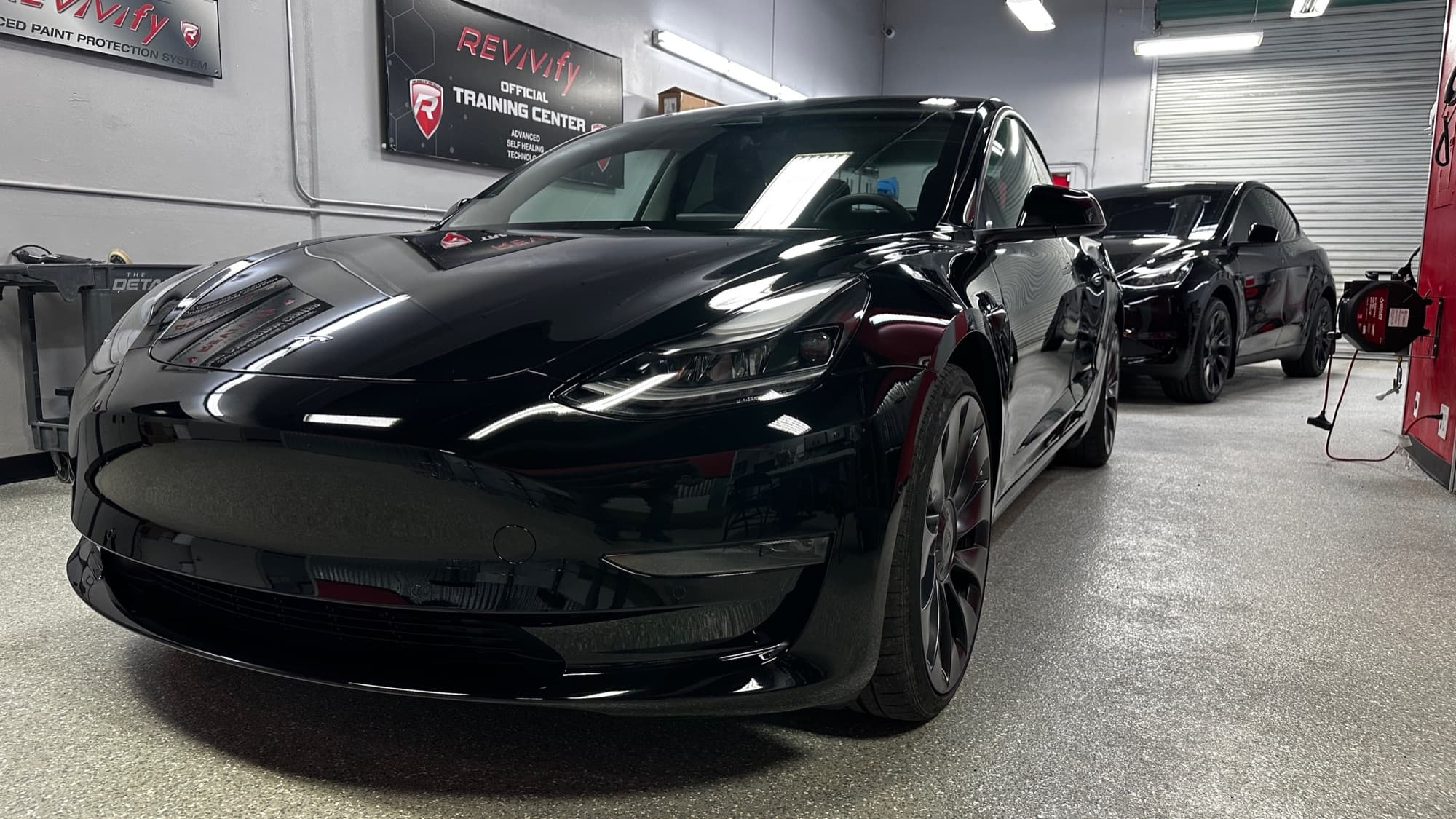 Black Tesla after paint correction and Revivify self-healing coating install