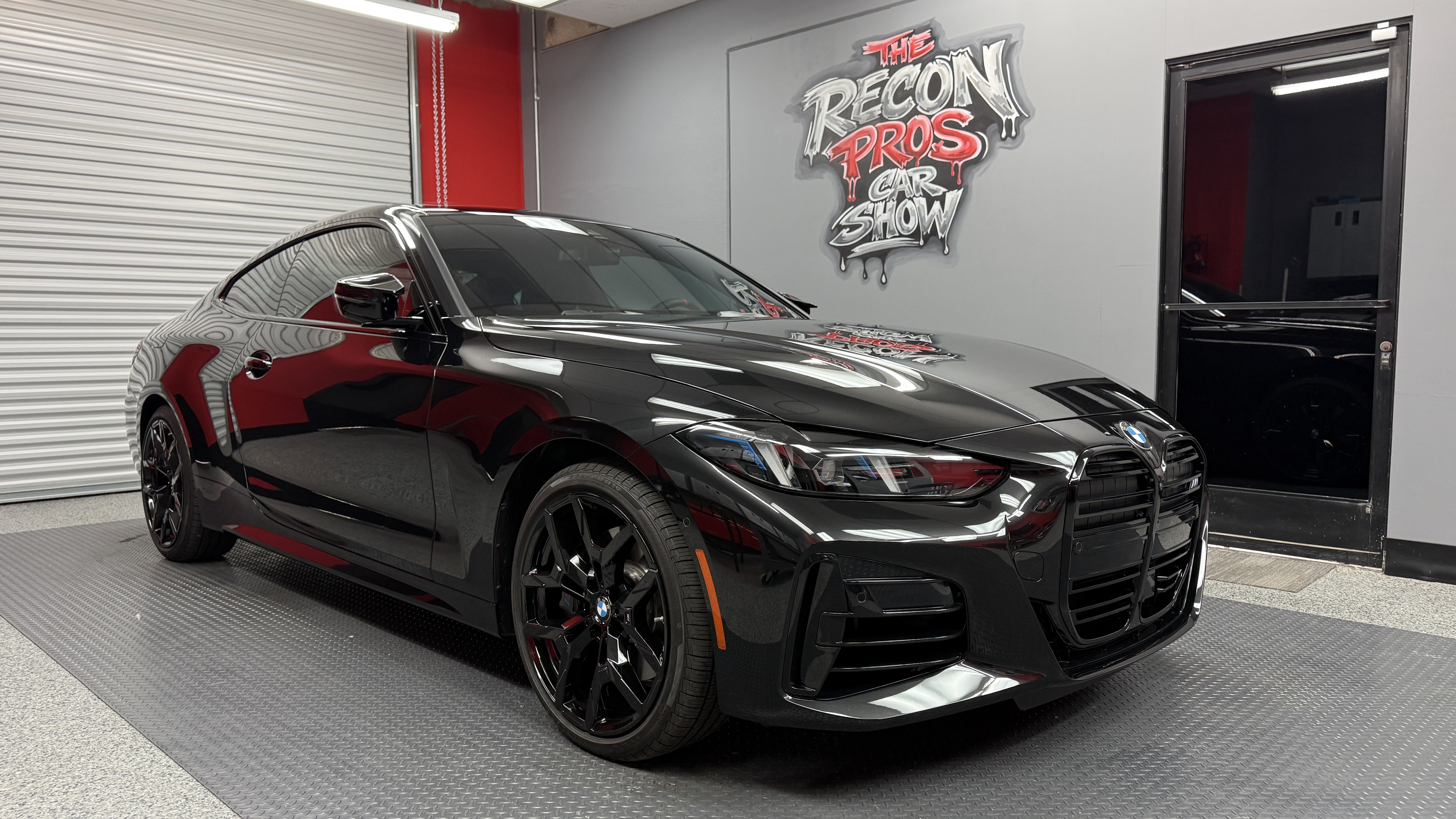 Jet-black 2026 BMW after full paint correction at The Recon Pros Huntington Beach
