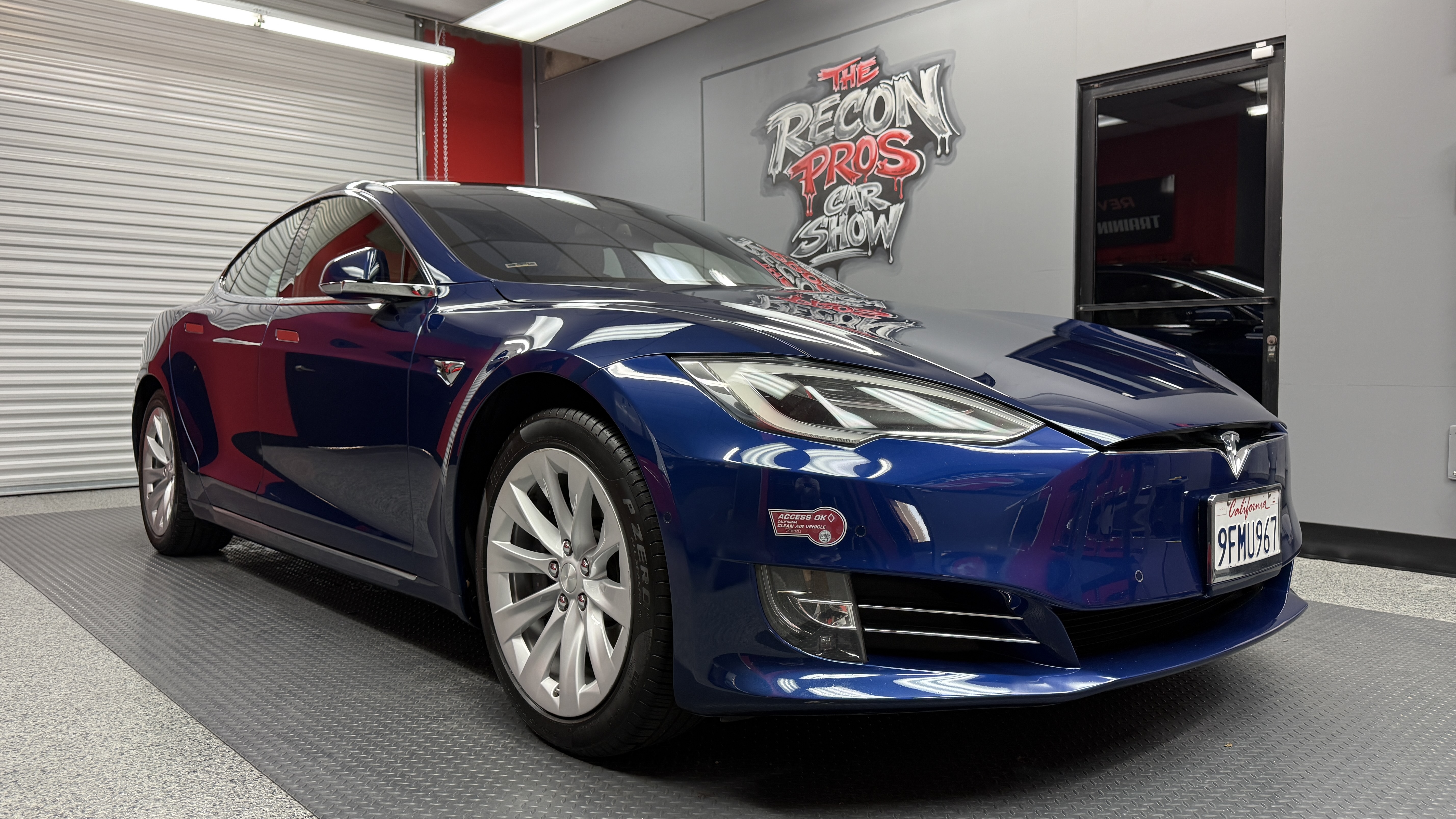 Blue Tesla Model S after chemical-damage decontamination and paint correction at The Recon Pros